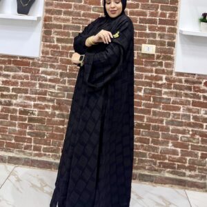 Woman in black traditional attire.