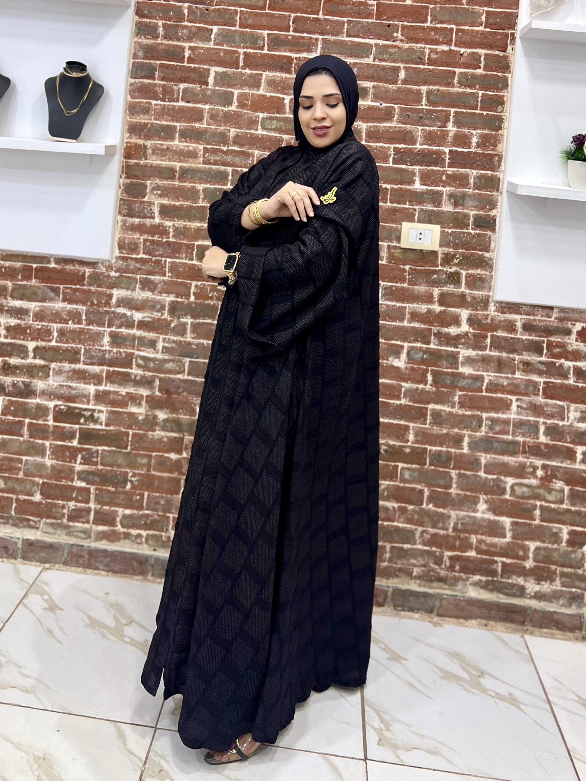 Woman in black traditional attire.
