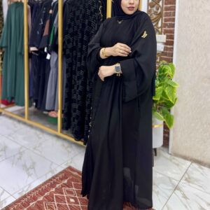 Woman in elegant black attire.