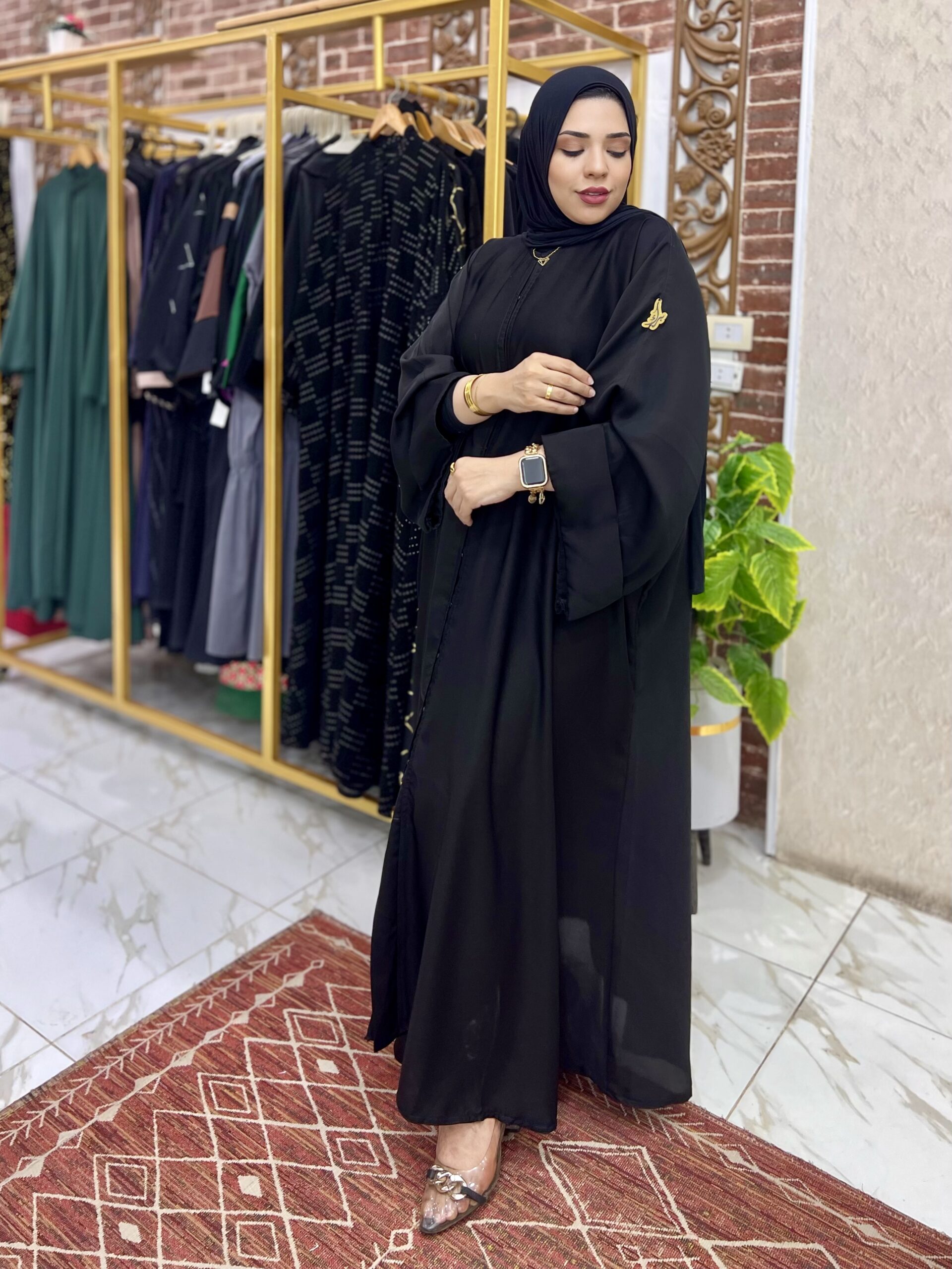 Woman in elegant black attire.